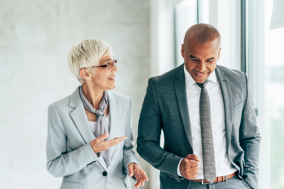 Client and advisor walking down a hallway